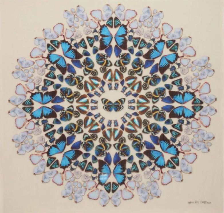 Mandala design made of butterflies on a beige background