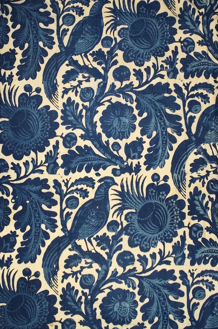 Blue floral and bird pattern on beige background